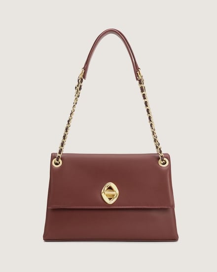 شنطة نسائية بمقاس كبير من الجلد بلون عودي