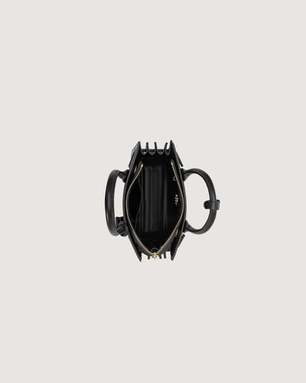 شنطة نسائية متوسطة الحجم بلون أسود