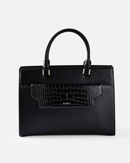 شنطة نسائية بحجم متوسط من الجلد بلون أسود