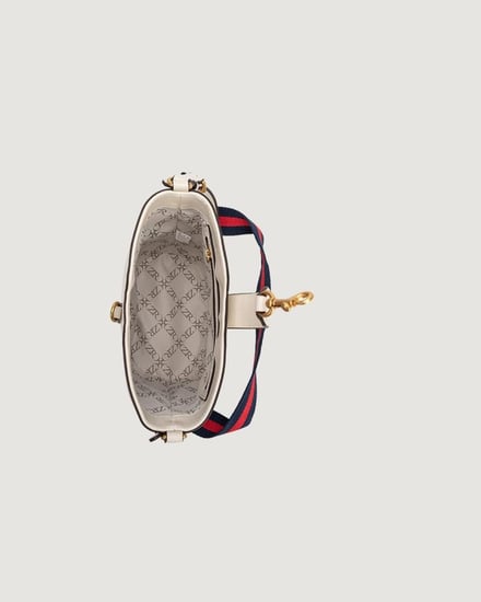 شنطة نسائية صغيرة بلون بيج لكل الأوقات