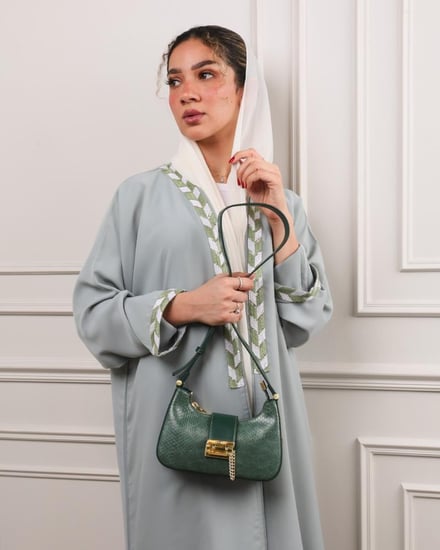 شنطة مِسك النسائية جلد بلون أخضر