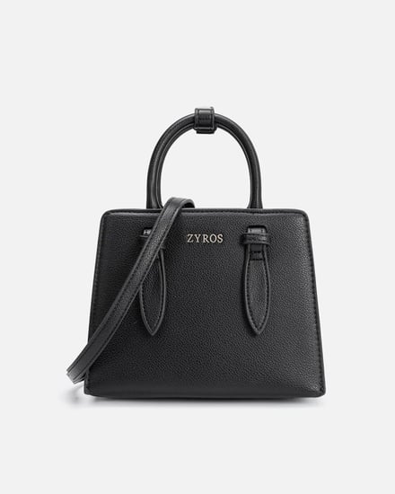 شنطة نسائية من الجلد بلون أسود