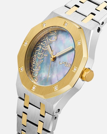 ساعة ألماس نسائية بلون فضي وذهبي