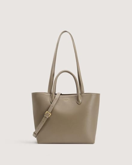 شنطة نسائية بحجم واسع باللون البني