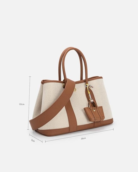 ‎ شنطة نسائية من القماش والجلد بلون بني وبيج