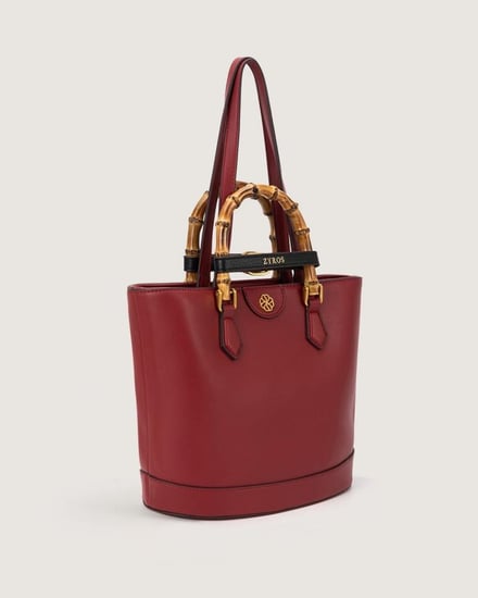 شنطة نسائية بتصميم عصري بلون عودي