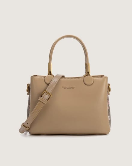 شنطة نسائية من الجلد باللون البني