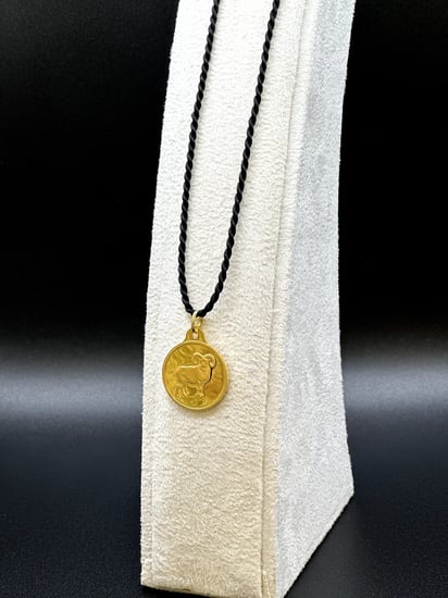 جنيه برج الحمل ذهب بي تي سي عيار 24 بوزن 8,2 غرام مع تعليقة