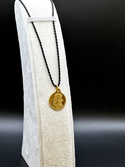 جنيه ذهب أنكل سكروج عيار 24 بي تي سي بوزن 8,2 غرام مع تعليقة