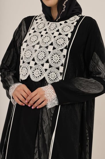 White guipure chest with lace cuffs and shaded godets