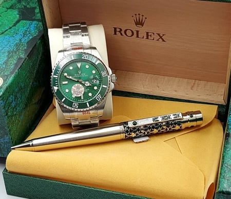 ساعة رولكس معا قلم كارتير درجه اولى معا علبه وكيس الماركه