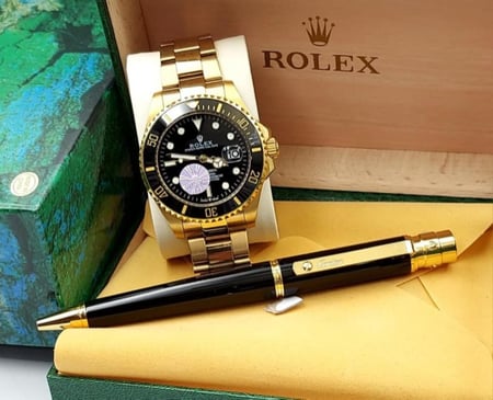 ساعة رولكس معا قلم كارتير درجه اولى معا علبه وكيس الماركه