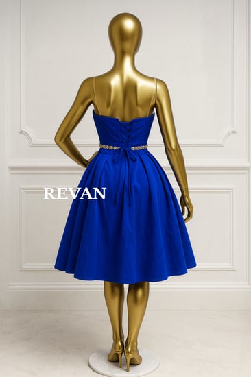 فستان سهرة ميدي ملكي بتصميم منفوش أناقة آسرة بلمسة ريڤــان