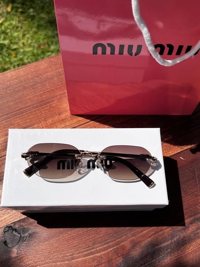 نظارة miu miu إطار ذهبي - عدسة بني مدرج