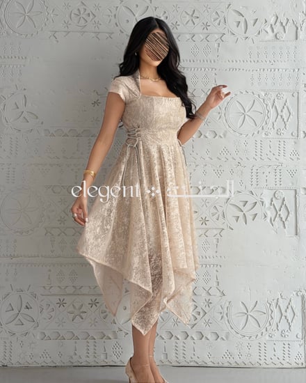 فستان نسائي أنيق بلون بيج بتصميم أنثوي وقصة واسعة من متجر إلجنت