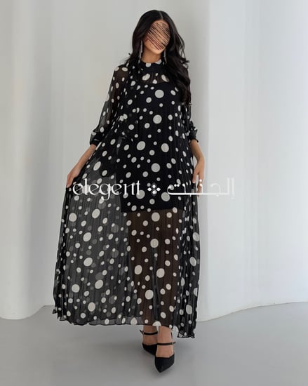 فستان نسائي منقط مع أكمام طويلة شفافة ولمسة أنثوية راقية