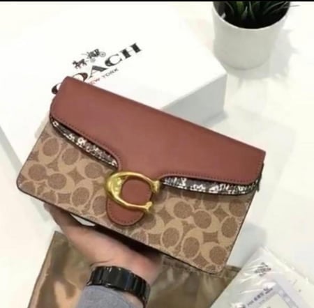 شنطة كروس كوتش تابي