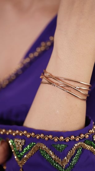 إسوارة ذهب عيار 18 و ألماس مدور وباجيت VS-SI