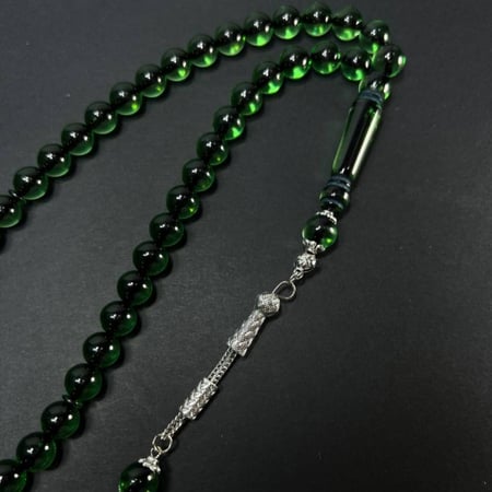 سبحة تراب كهرمان -بكلايت- شكة - زيتي شفاف مكحل بخيط اسود مميز