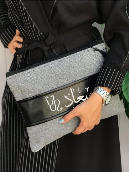 شنطة باوتش نوتيد قماش و حزام جلد متعددة الوان