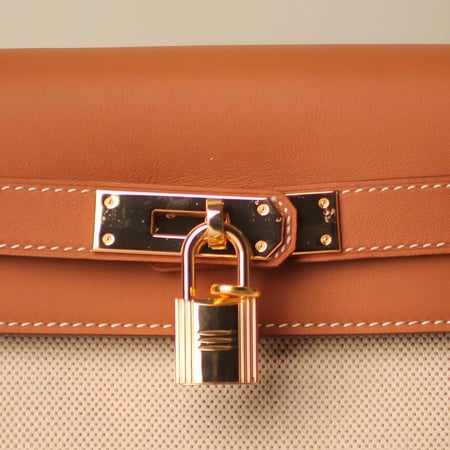 شنطة كيلي جلد جودة عالية باللون البرتقالي