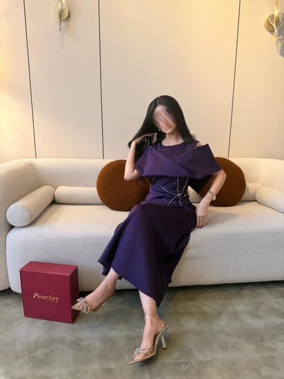 فستان بنفسجي بتفصيل نجمي