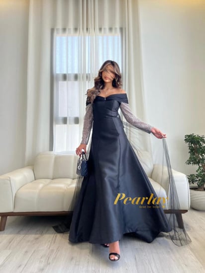 فستان سهره اسود باكمام شفافه فضي