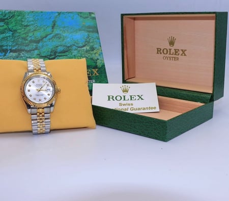 ساعة رولكس مع كيس وعلبه رولكس