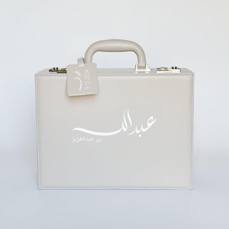 حقيبة جلدية فاخرة بلباس من TED BAKER