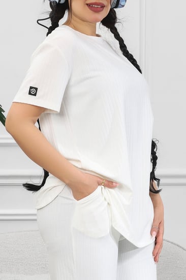 ترنج نسائي كاجوال ريب سادة تيشرت قصير من الأمام وظهر طويل بياقة دائرية وبنطال مزود بجيب جانبية