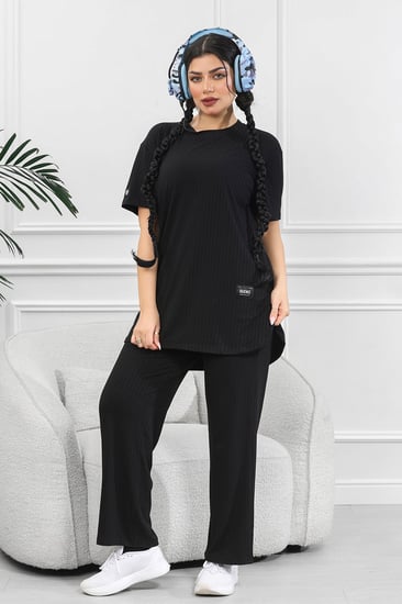 ترنج نسائي كاجوال ريب سادة تيشرت قصير من الأمام وظهر طويل بياقة دائرية وبنطال مزود بجيب جانبية