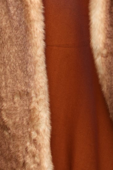 فروة شتوية مبطنة مع فرو على الأطراف