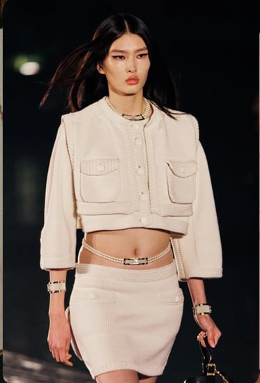 Chanel white vest with buckets 2025 جيليه شانيل أوف وايت بجيوب أمامية
