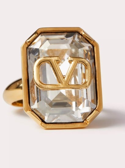 2024 خاتم فالانتينو قرافاني V لوقو سيجنتشار معدن ذهبي و كرستال ابيض شفاف