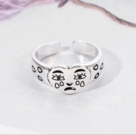 Sad face ring
