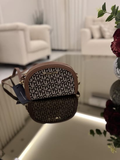 شنطه تومي نص دائره يوميه