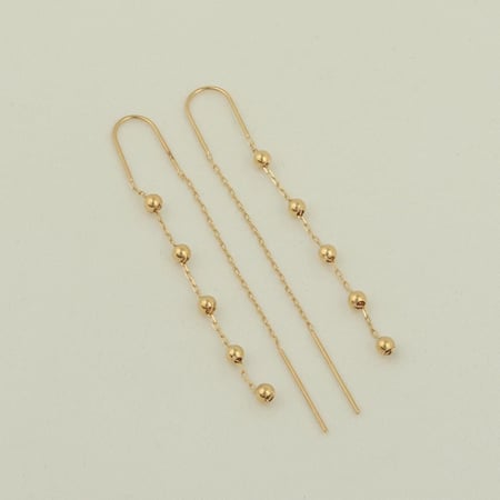 حلق كرات الذهب