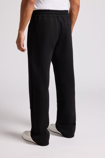 بنطلون جيرسيه مرن أوفرسايز للجنسين - أسود