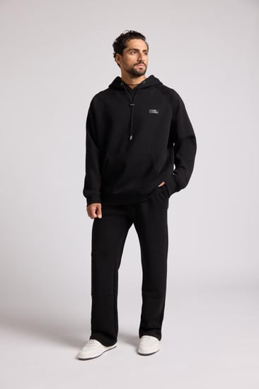 بنطلون جيرسيه مرن أوفرسايز للجنسين - أسود