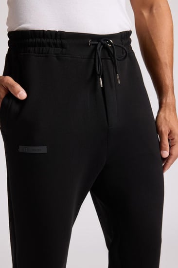 بنطلون جيرسيه مرن أوفرسايز للجنسين - أسود