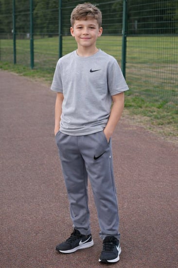 بنطلون رياضي للجنسين يحتوي على علامة نايك رمادي