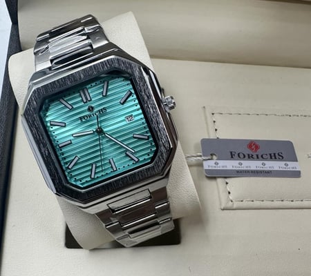 ساعة رجالية من ماركة FORICHS اللون فضي ميناء سماوي