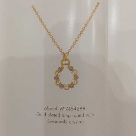 سلسلة اجنر ذهبيه مطليه بلوقو اجنر وكريستال سوارفسكي AJ64288 Gold plated long round with Swarovski crystals