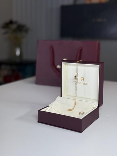 اسوار اجنر ذهبي بعلامه عريضه A بالكريستال Aigner gold fashion bracelet crystal logo