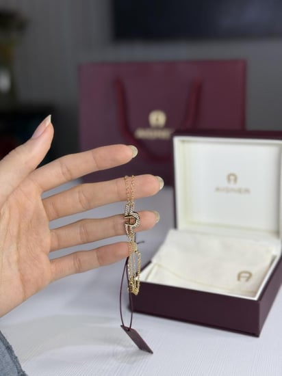اسوار اجنر ذهبي بعلامه عريضه A بالكريستال Aigner gold fashion bracelet crystal logo