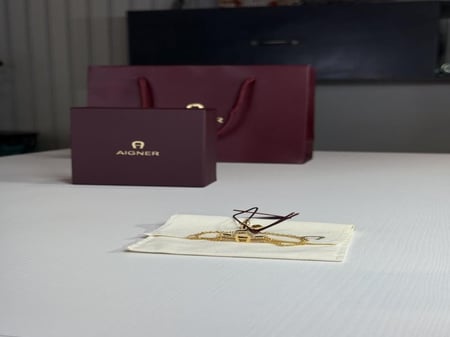 اسوار اجنر ذهبي بعلامه عريضه A بالكريستال Aigner gold fashion bracelet crystal logo