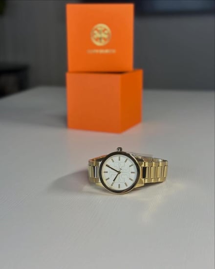 توري برتش ساعه جيجي Tory Burch TBW2010 Gigi Gold بمينا لوقو ابيض- ذهبي
