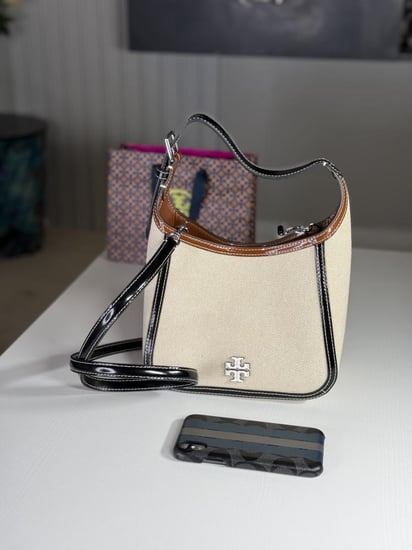 شنطة توري برتش كانفاس THEA CANVAS SMALL BUCKET BAG كامل وايت مع تفاصيل بلون بني واسود