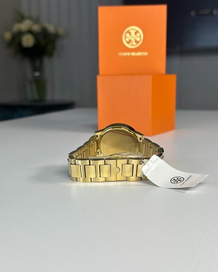 توري برتش ساعه جيجي Tory Burch TBW2010 Gigi Gold بمينا لوقو ابيض- ذهبي