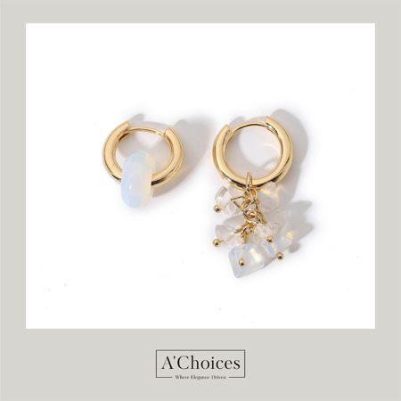 اقراط ذهبية مزينة بأحجار كريمة بتصميم معاصر غير متماثل